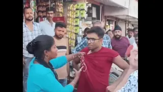 Wife Beats Husband In Public; Holds Collar And Asks Passersby To Take Video | Internet Reacts